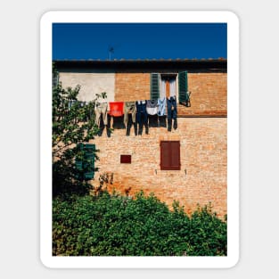 Laundry Drying on Washing Line Against Old Brick Building in Tuscany Italy Sticker